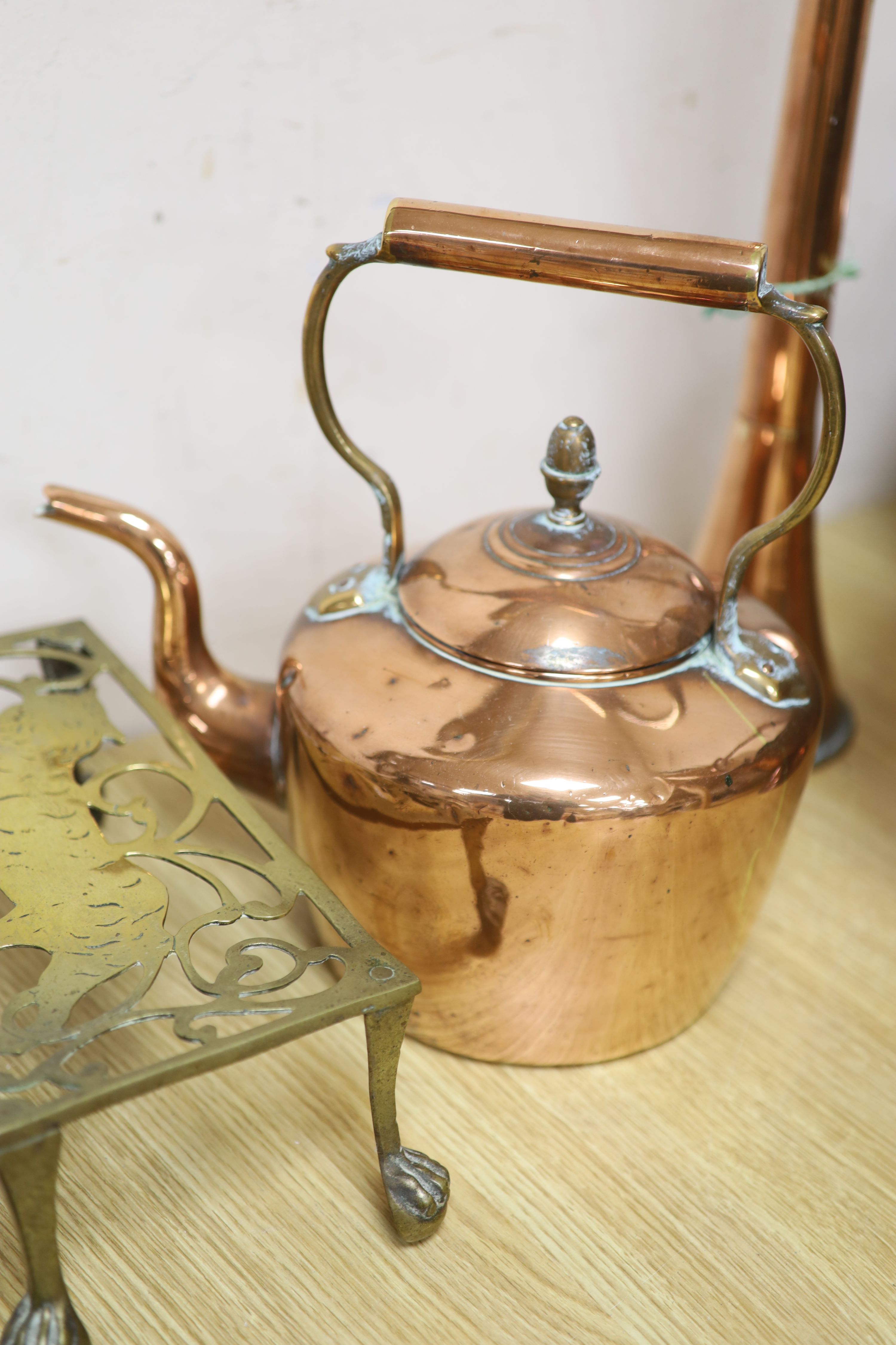 A Victorian copper coal helmet, A Victorian copper kettle, a Victorian copper coaching horn and sundry metalware